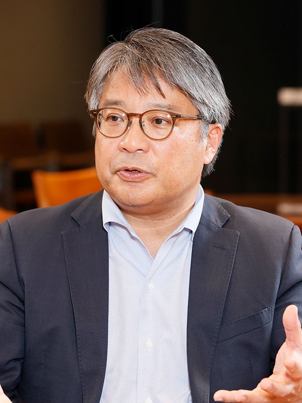 萩野 琢英氏