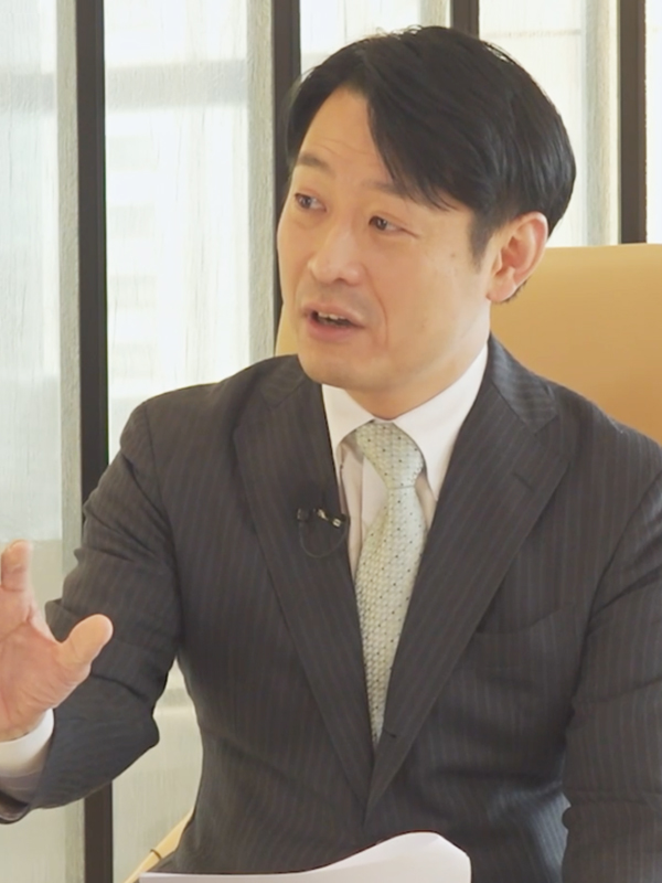 萩野 琢英氏